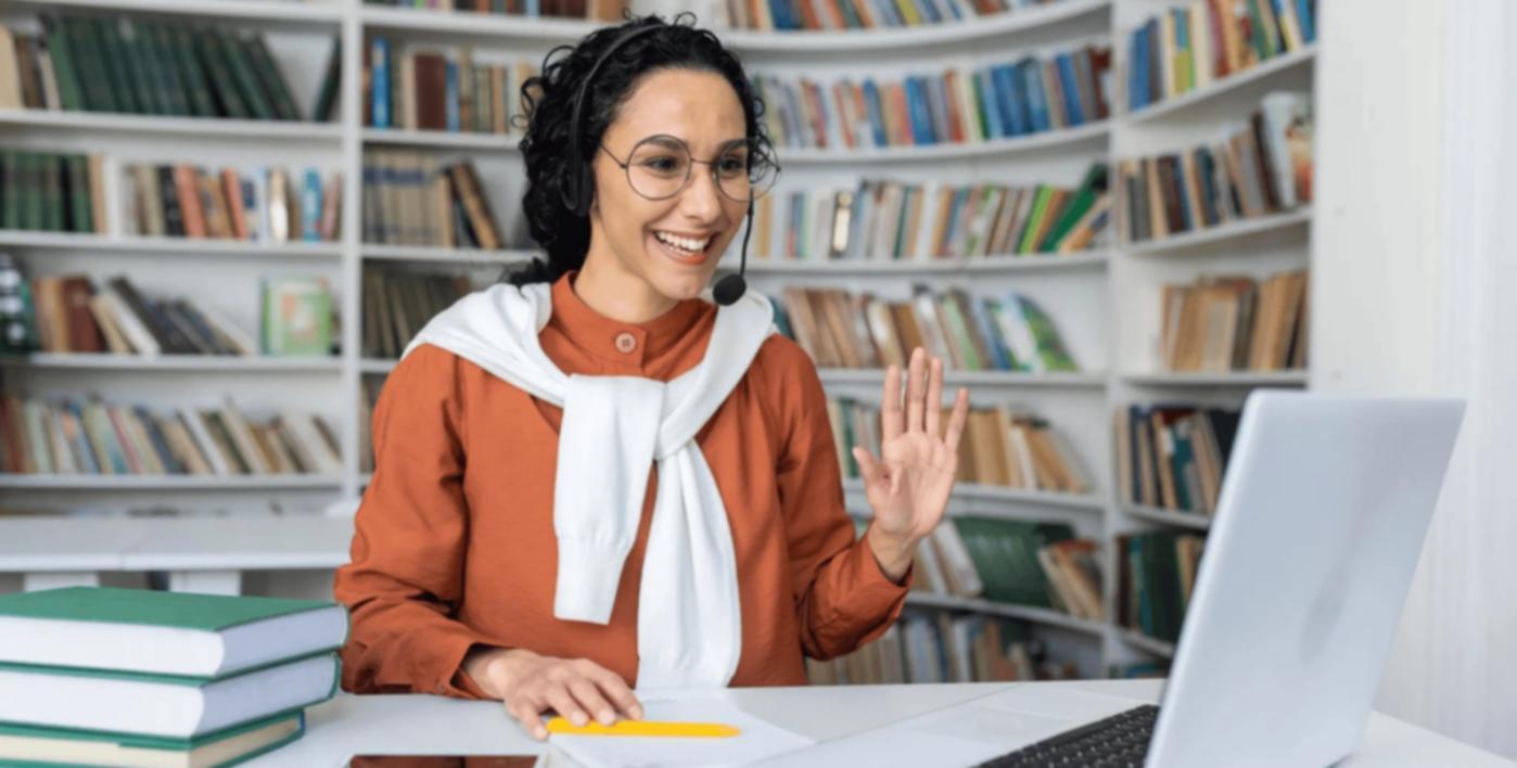 Student working through integration testing exercises on laptop in classroom environment
